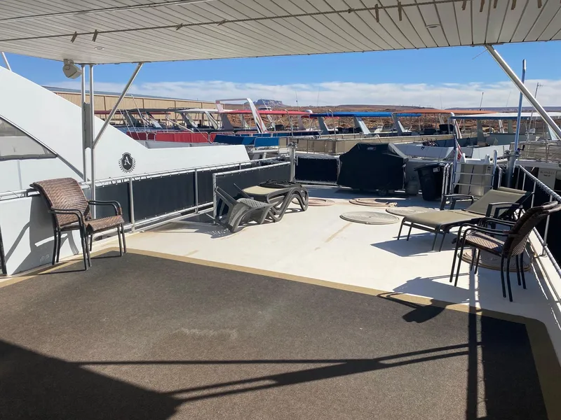 Slide: The Image of Spacious deck of 2012 Bravada Ho'Okipa Trip #1 houseboat with seating and marina view. - 11