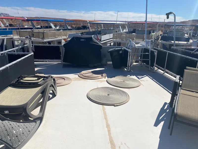 Slide: The Image of Upper deck of 2012 Bravada Ho'Okipa Trip #1 houseboat with lounge chairs and grill. - 12