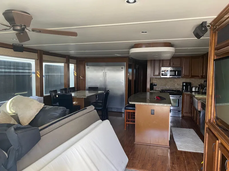 Slide: The Image of Luxurious 2012 Bravada Ho'Okipa Trip #1 houseboat interior with modern kitchen and dining area. - 5