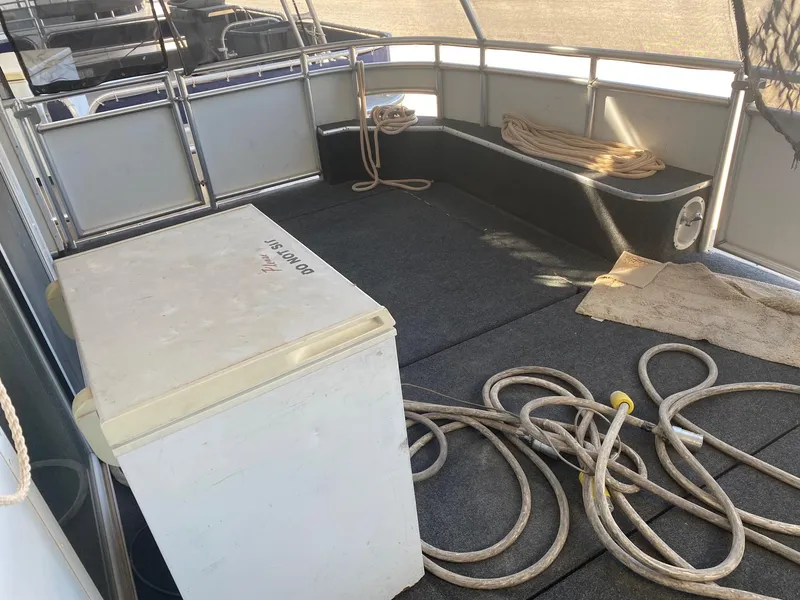 Slide: The Image of 2012 Bravada Ho'Okipa Trip #1 boat deck with ropes and storage box. - 8