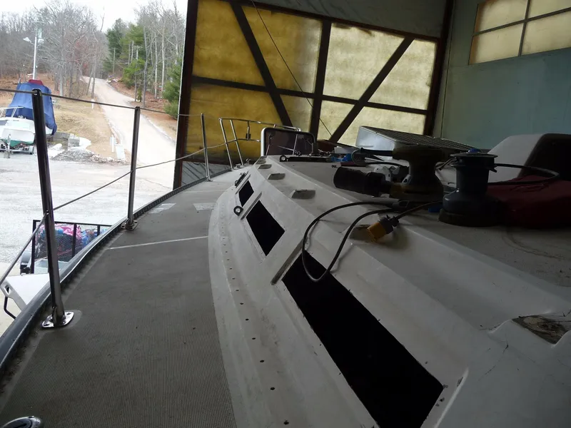Slide: The Image of 1985 S2 9.1 sailboat undergoing maintenance in a boatyard. - 21