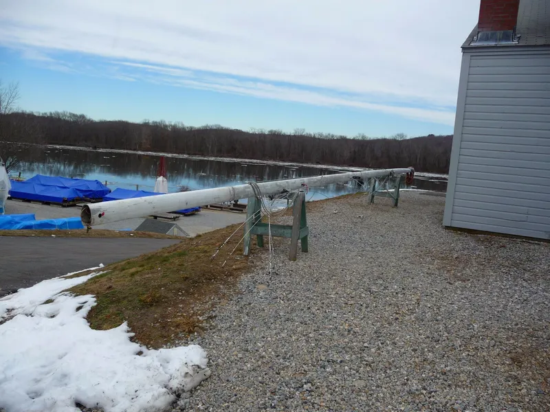 Slide: The Image of Sailboat mast from 1985 S2 9.1 model on stands by a lake in winter. - 27