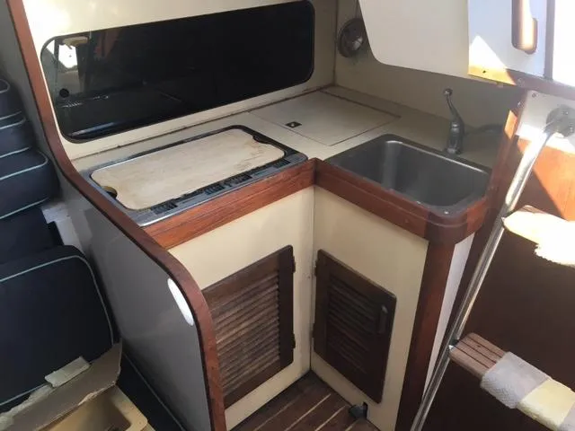 Slide: The Image of Compact galley kitchen in 1985 S2 9.1 sailboat with sink and stove. - 6