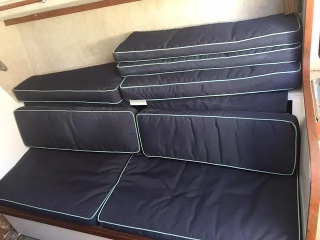 Slide: The Image of Navy blue cushions in the cabin of a 1985 S2 9.1 sailboat. - 8