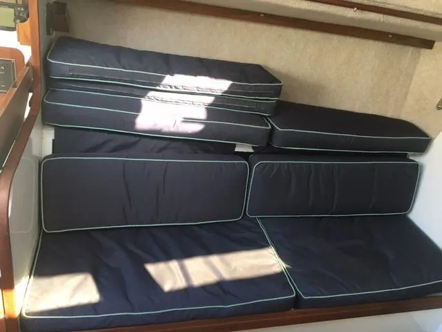 Slide: The Image of 1985 S2 9.1 sailboat interior cushions in navy blue. - 9