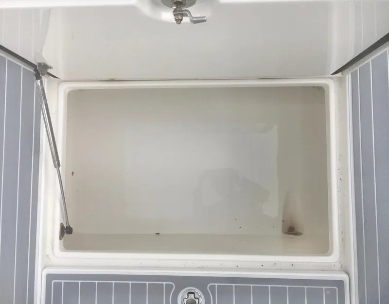 Slide: The Image of 2012 Jupiter 26 Forward Seating boat with open storage compartments. - 13