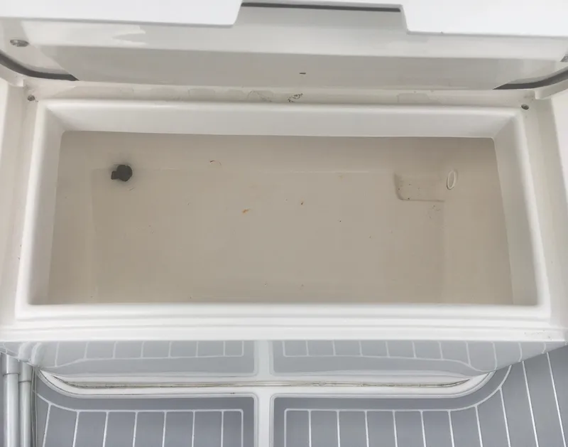 Slide: The Image of 2012 Jupiter 26 Forward Seating boat interior with cushioned seating and non-slip flooring. - 14