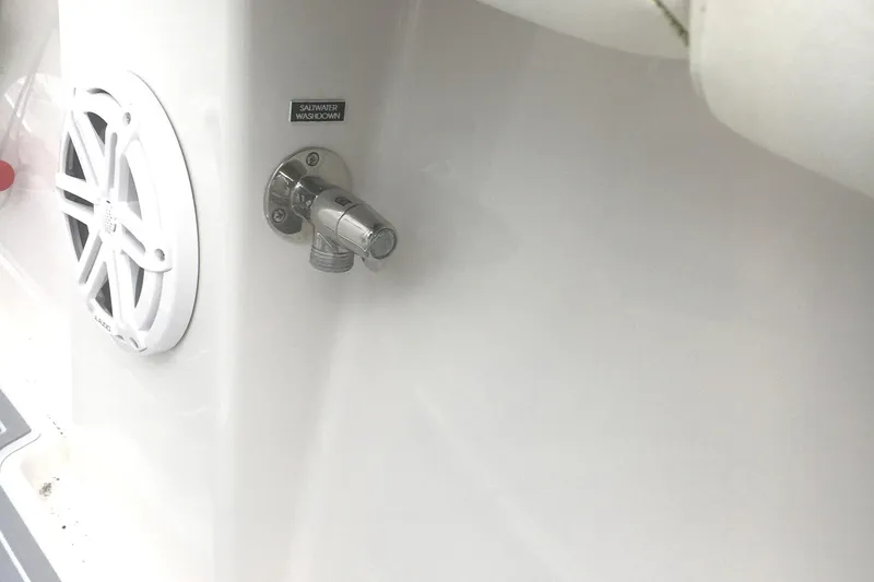 Slide: The Image of 2012 Jupiter 26 Forward Seating boat interior with speaker and water connection. - 17