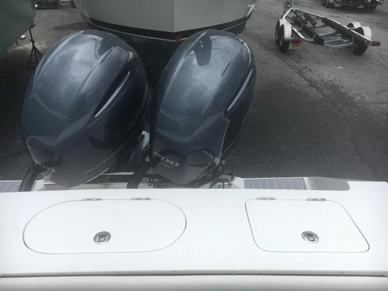 Slide: The Image of 2012 Jupiter 26 Forward Seating boat with dual outboard engines. - 18