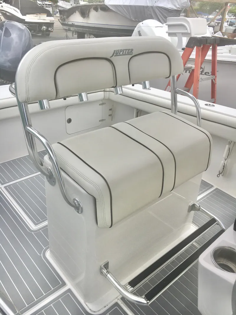 Slide: The Image of 2012 Jupiter 26 Forward Seating boat cockpit with modern controls and seating. - 8