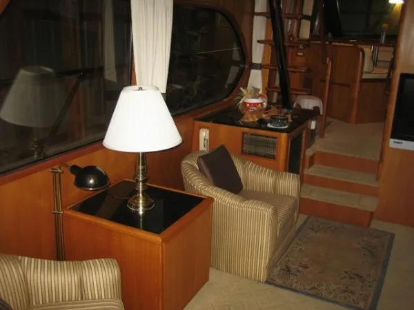 Slide: The Image of Luxurious bedroom in 1998 Ocean Alexander Pilothouse Model 584 yacht, featuring elegant bedding. - 12