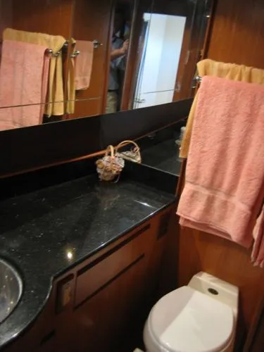 Slide: The Image of 1998 Ocean Alexander Pilothouse Model 584 yacht in a wooden storage facility. - 19