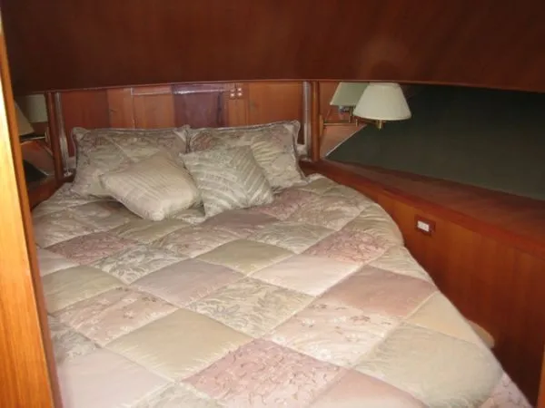 Slide: The Image of 1998 Ocean Alexander Pilothouse Model 584 yacht stored in a wooden boathouse. - 21