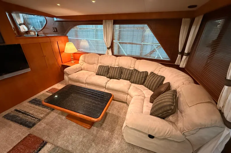 Slide: The Image of Luxurious 1998 Ocean Alexander Pilothouse Model 584 interior with helm, seating, and dining area. - 37