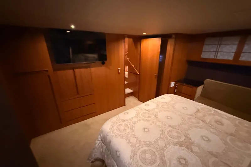 Slide: The Image of Luxurious bathroom in 1998 Ocean Alexander Pilothouse Model 584 yacht, featuring wood accents and modern fixtures. - 46