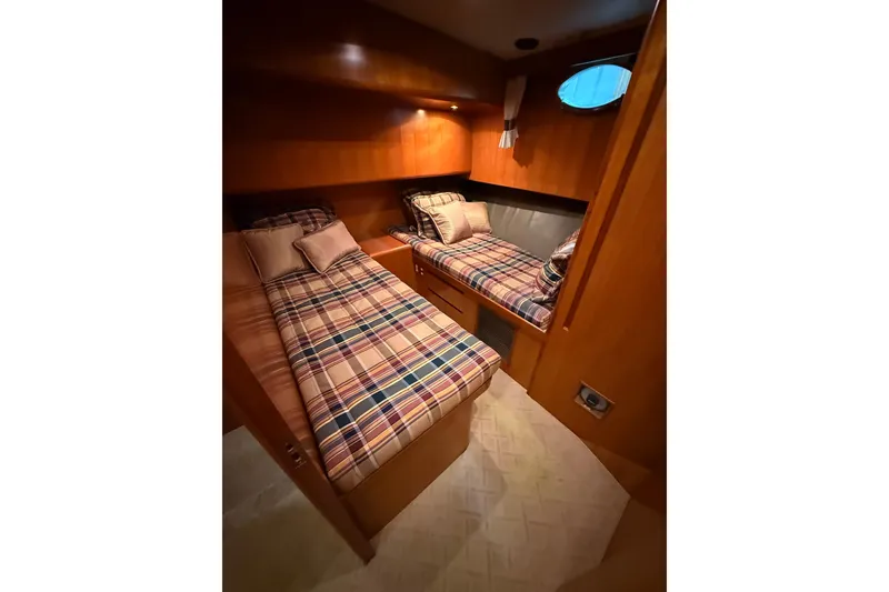 Slide: The Image of 1998 Ocean Alexander Pilothouse Model 584 interior with navigation controls and seating area. - 53