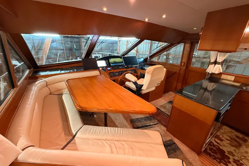 Slide: The Image of Luxurious 1998 Ocean Alexander Pilothouse Model 584 interior with plush seating and elegant decor. - 55