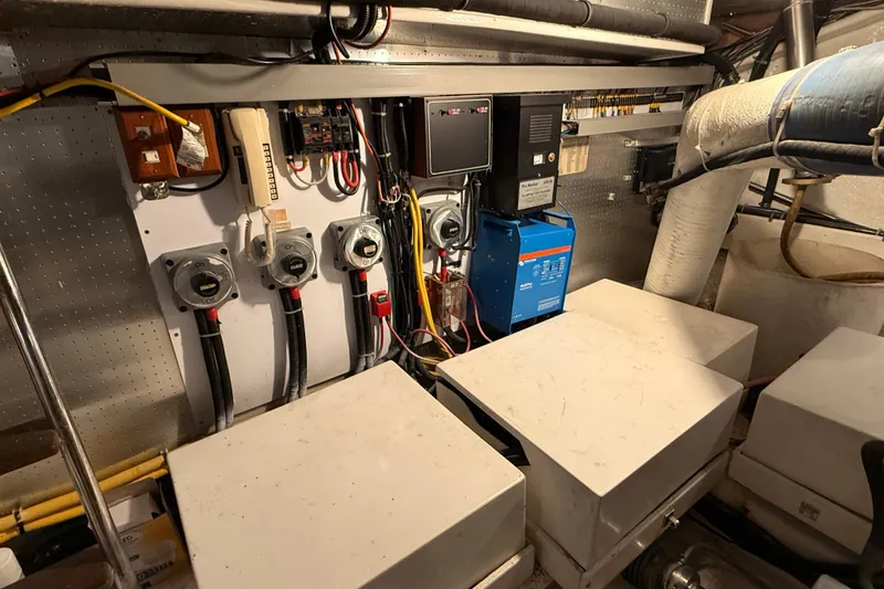 Slide: The Image of 1998 Ocean Alexander Pilothouse Model 584 yacht interior with wooden deck and cozy seating area. - 62