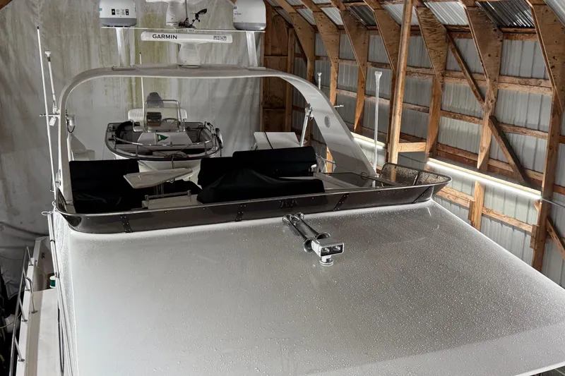 Slide: The Image of 1998 Ocean Alexander Pilothouse Model 584 yacht in a wooden boathouse, top view. - 25