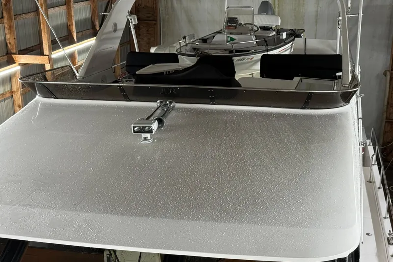 Slide: The Image of 1998 Ocean Alexander Pilothouse Model 584 yacht in a storage facility. - 26