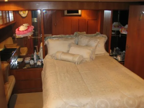 Slide: The Image of 1998 Ocean Alexander Pilothouse Model 584 helm with modern navigation equipment and leather seating. - 3