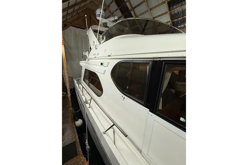 Slide: The Image of 1998 Ocean Alexander Pilothouse Model 584 interior with sink and storage area. - 32