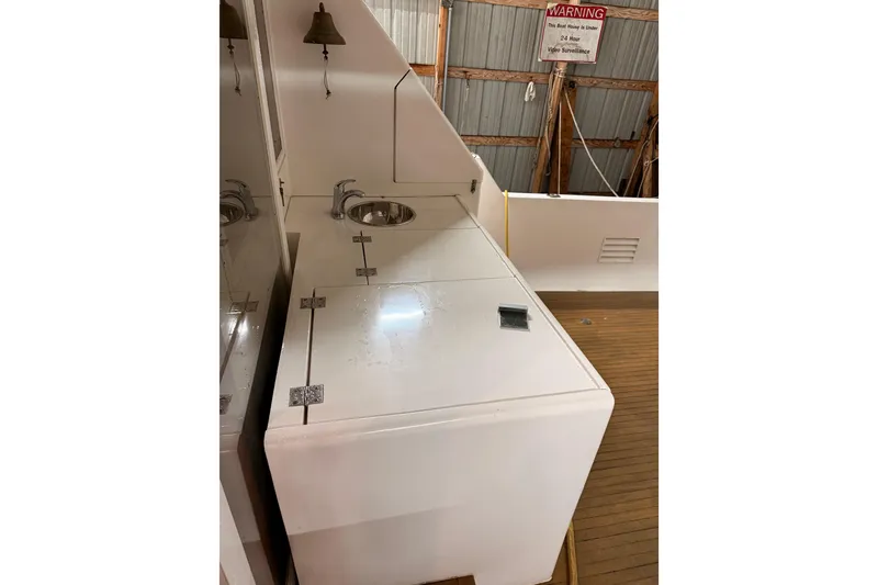 Slide: The Image of Cozy interior of 1998 Ocean Alexander Pilothouse Model 584 with armchairs and lamp. - 34