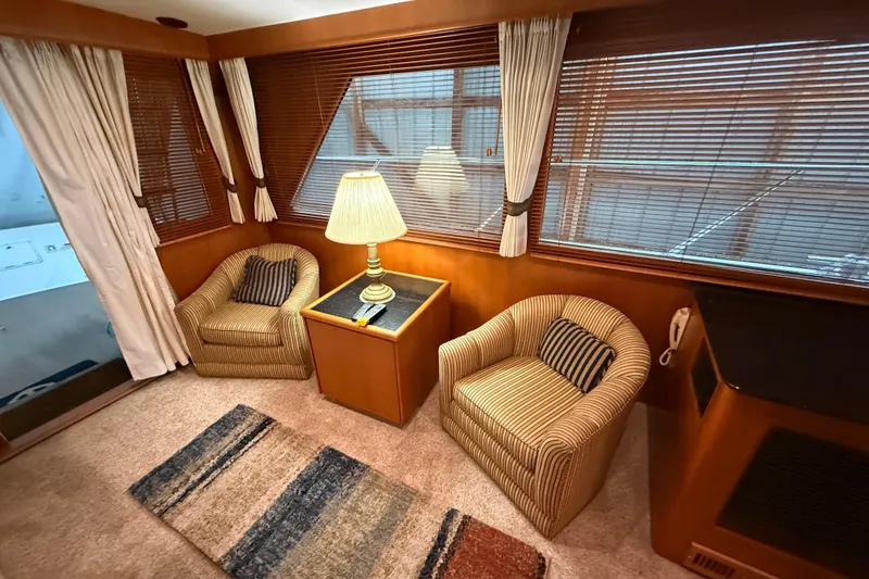 Slide: The Image of Luxurious interior of 1998 Ocean Alexander Pilothouse Model 584 with cozy seating and elegant decor. - 36