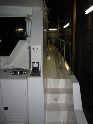 Slide: The Image of 1998 Ocean Alexander Pilothouse Model 584 helm with navigation and control systems. - 5