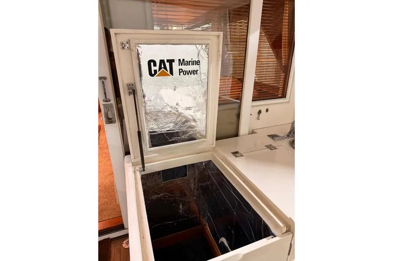 Slide: The Image of Engine room of 1998 Ocean Alexander Pilothouse Model 584 with fire extinguisher and fuel filters. - 60