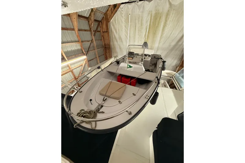 Slide: The Image of 1998 Ocean Alexander Pilothouse Model 584 in a wooden boathouse, showcasing deck and equipment. - 66