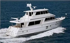 Slide: The Image of 2025 Endurance 700 LRC Skylounge MY yacht cruising on open water. - 2