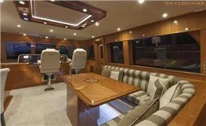 Slide: The Image of Luxurious interior of 2025 Endurance 700 LRC Skylounge MY yacht with elegant seating and helm. - 6