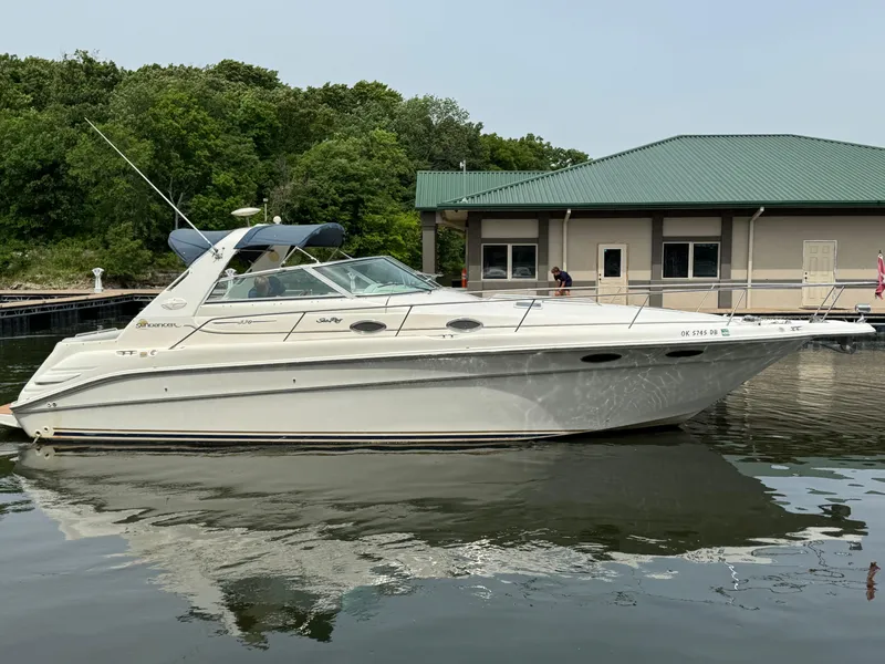 The Image of 1998 Sea Ray 330 Sundancer yacht docked near a marina. - 0