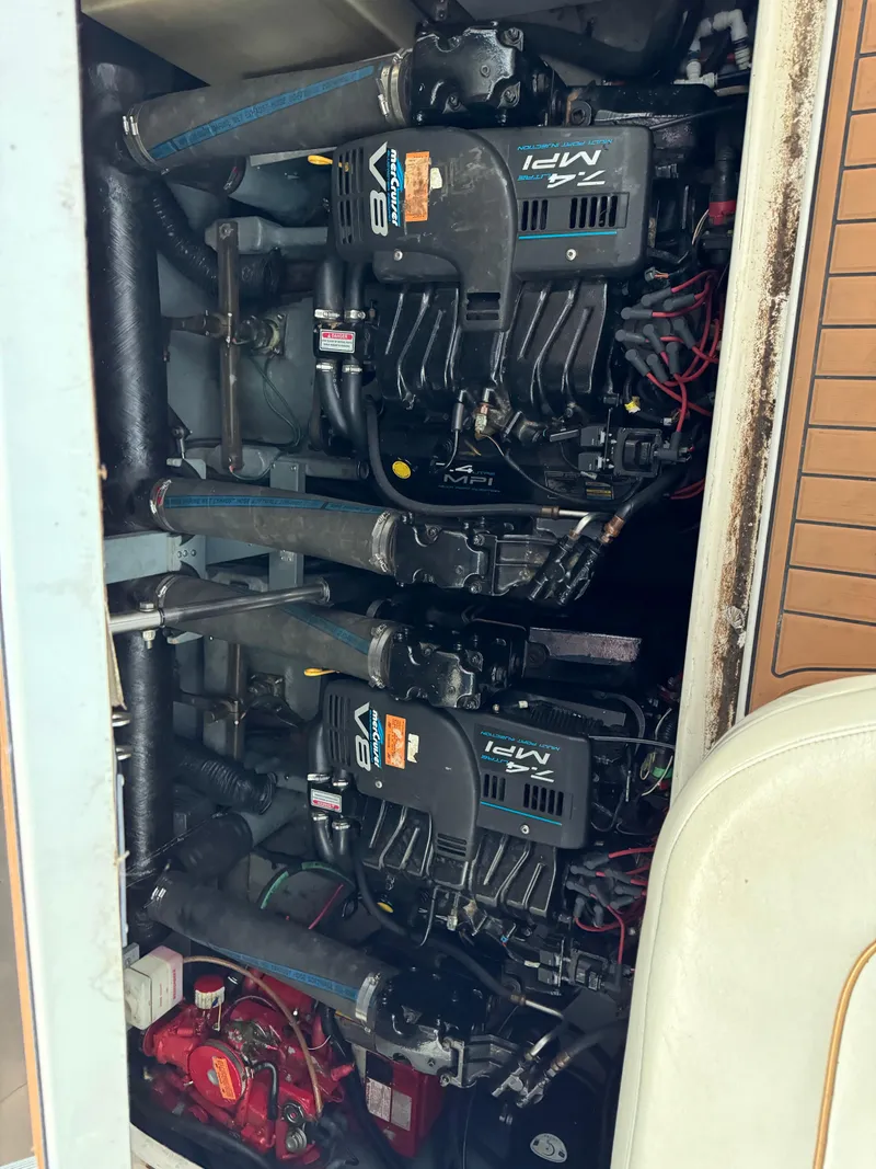 Slide: The Image of 1998 Sea Ray 330 Sundancer engine compartment with twin V8 engines. - 16