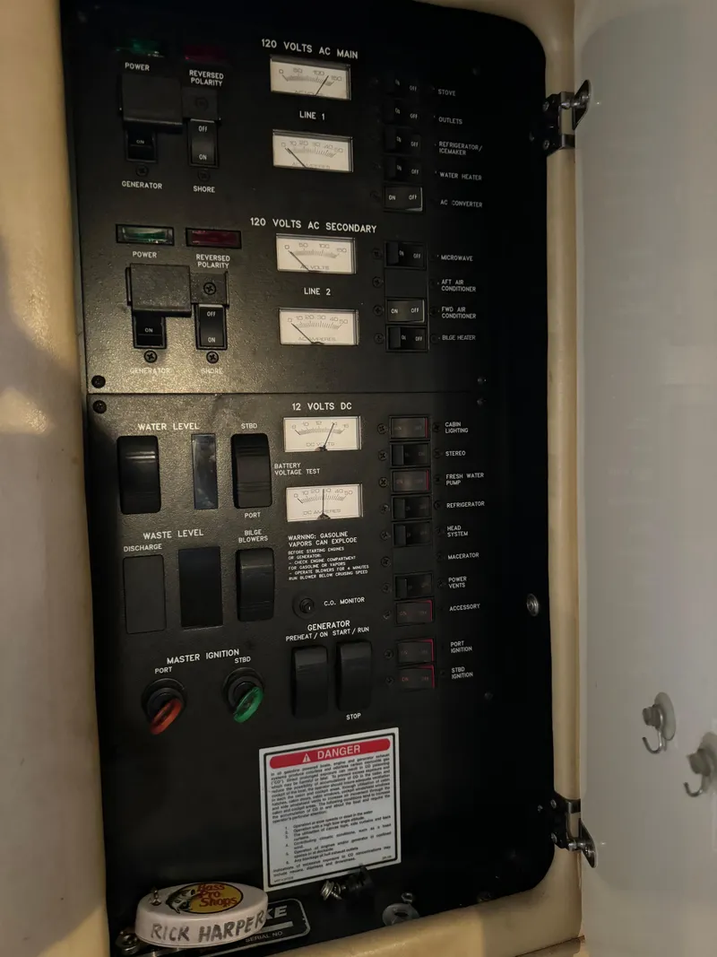 Slide: The Image of Electrical control panel of a 1998 Sea Ray 330 Sundancer boat. - 19