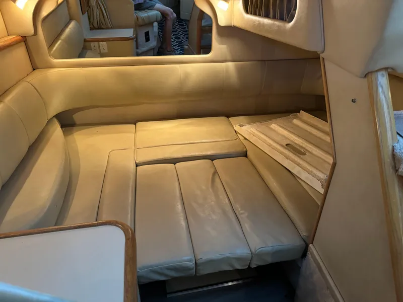 Slide: The Image of Interior cabin seating of a 1998 Sea Ray 330 Sundancer boat. - 22