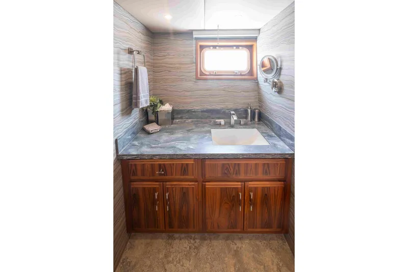 Slide: The Image of Luxurious 1972 DITTMAR & DONALDSON motoryacht bathroom with elegant wood cabinetry and marble countertop. - 11