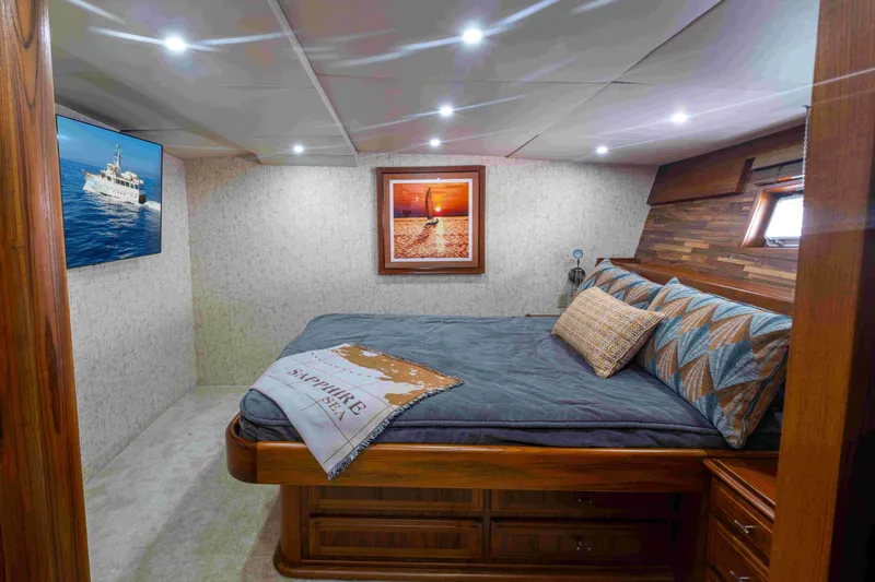 Slide: The Image of Cozy bedroom interior of 1972 DITTMAR & DONALDSON motoryacht with nautical decor and soft lighting. - 19