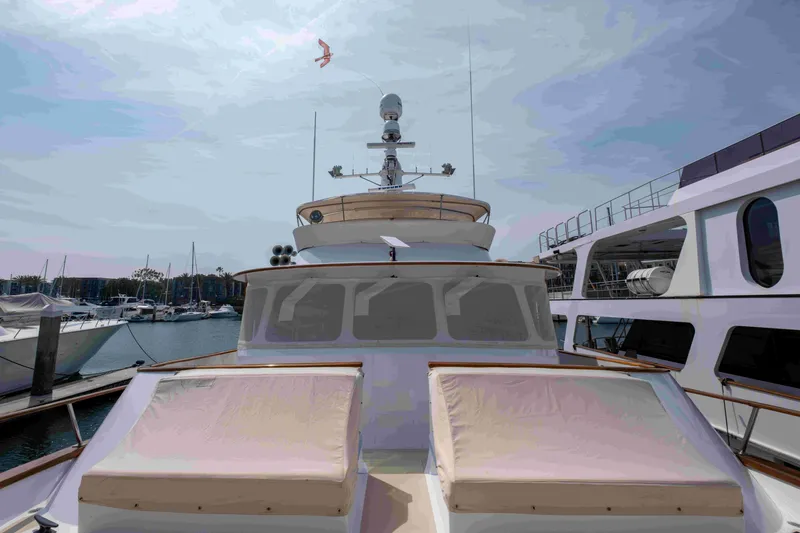 Slide: The Image of 1972 DITTMAR & DONALDSON Motoryacht docked at marina, clear sky, luxury vessel. - 21