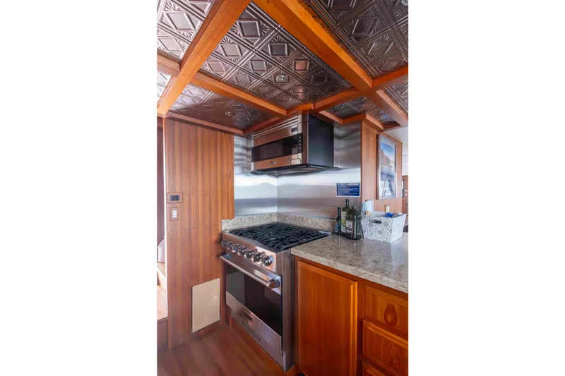 Slide: The Image of Luxurious 1972 DITTMAR & DONALDSON motoryacht kitchen with wood accents and modern appliances. - 3