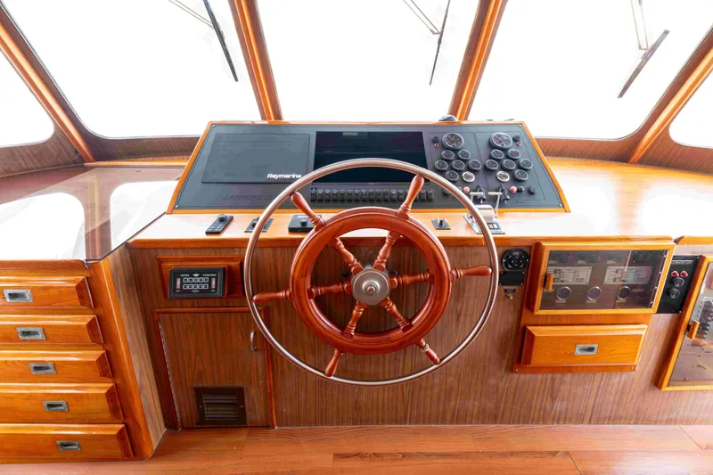 Slide: The Image of 1972 DITTMAR & DONALDSON Motoryacht helm with wooden wheel and navigation instruments. - 6