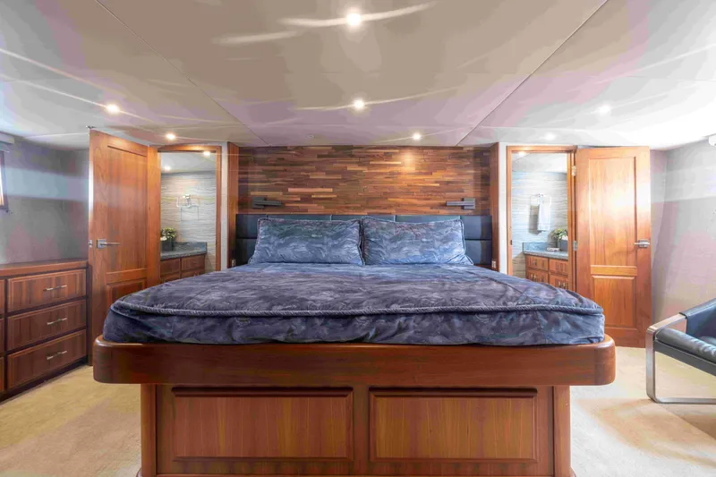 Slide: The Image of Luxurious 1972 DITTMAR & DONALDSON motoryacht bedroom with elegant wood finishes and plush bedding. - 7