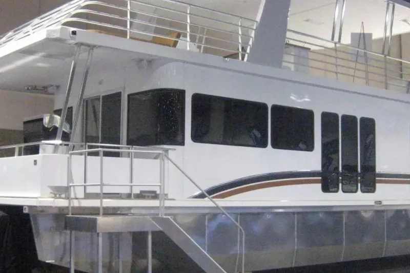 The Image of 2010 Destination Yachts Star Chaser houseboat with sleek design and modern features. - 1