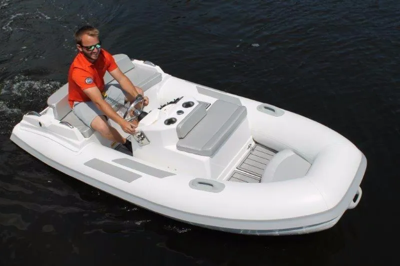 Slide: The Image of 2018 Ribjet 10 Jet Yacht Tender on water with driver. - 17