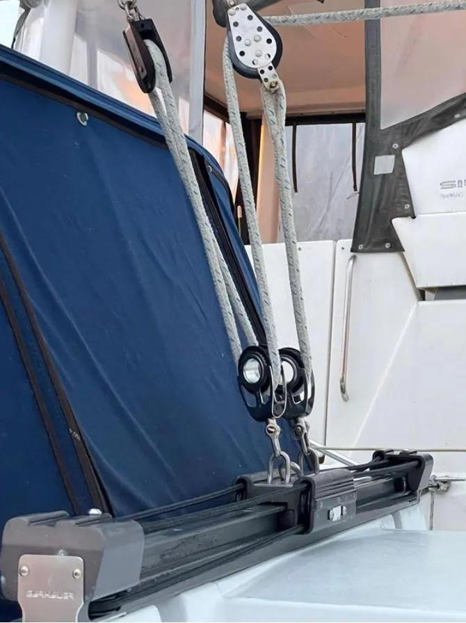 Slide: The Image of Sailing rigging on a 1985 Gib'Sea 126 yacht, featuring ropes and pulleys. - 16