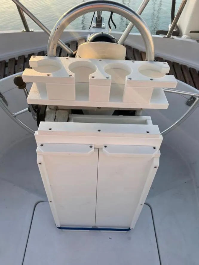 Slide: The Image of Cockpit of 1985 Gib'Sea 126 sailboat with steering wheel and cup holders. - 21