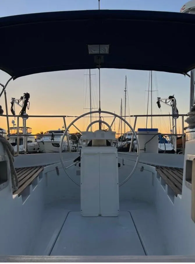 Slide: The Image of Cockpit view of 1985 Gib'Sea 126 sailboat at sunset in marina. - 24