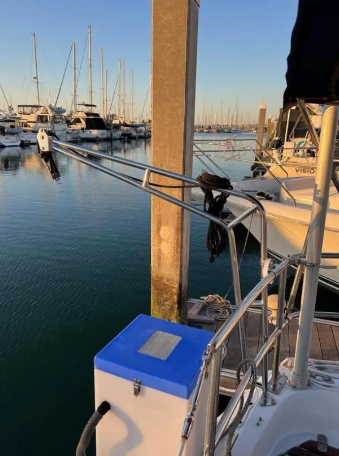 Slide: The Image of 1985 Gib'Sea 126 sailboat docked in a marina at sunset. - 27