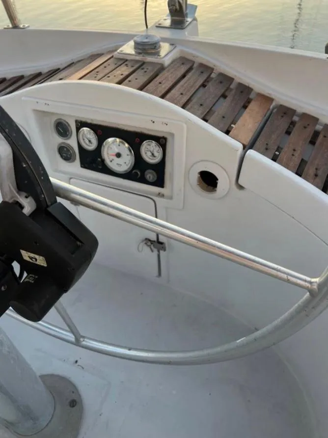 Slide: The Image of Cockpit of 1985 Gib'Sea 126 sailboat with steering wheel and instrument panel. - 29